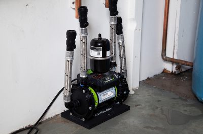 A shower pump set up in a room