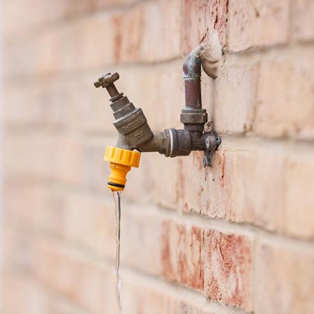 An outdoor tap struggling with water pressure