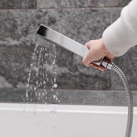 A handheld shower running water