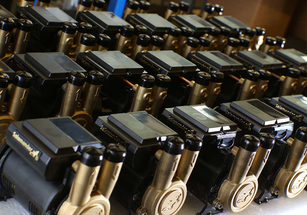 A group of shower pumps sitting on a table