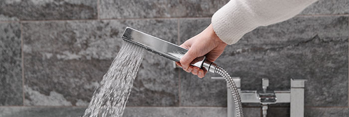 Powerful shower in hand narrow banner